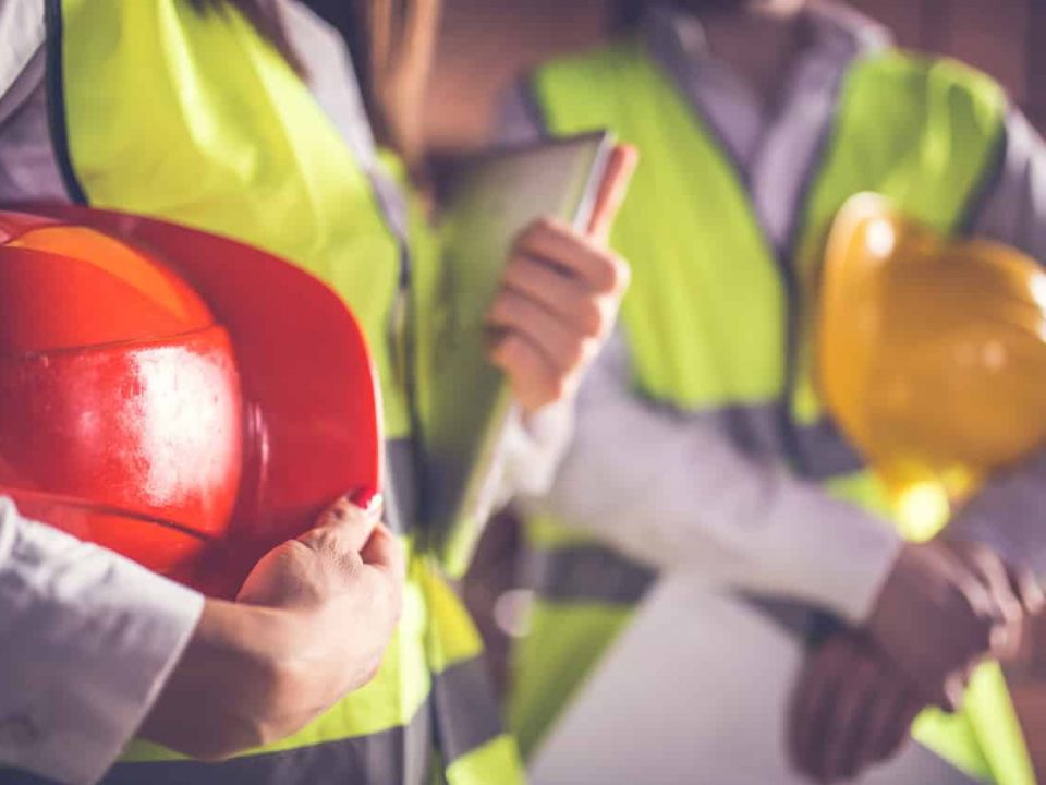 two people standing in safety gear