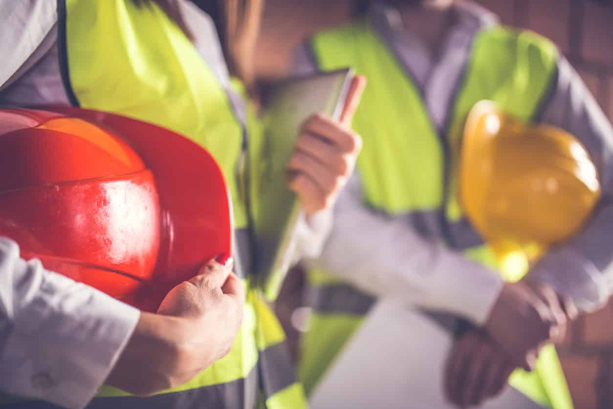 two people standing in safety gear