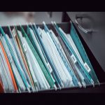 Important owners corporation records and documents in a filing cabinet